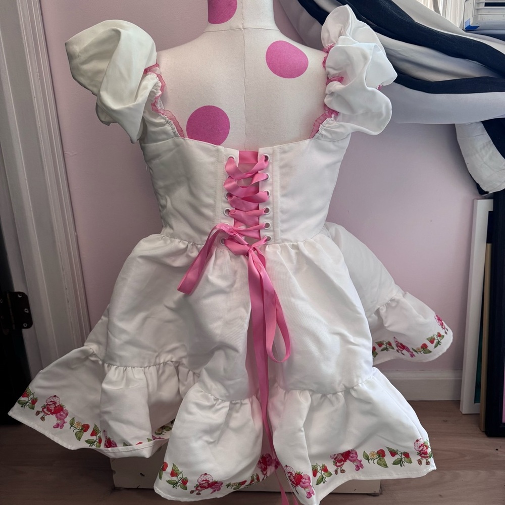 Cheerful Spirits Fit N’ Flare Dress
Care Bears x Strawberry Shortcake - Picture 3 of 5